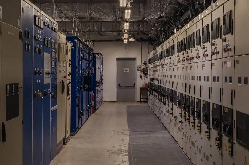 A sophisticated control room filled with electrical panels and equipment for industrial purposes.